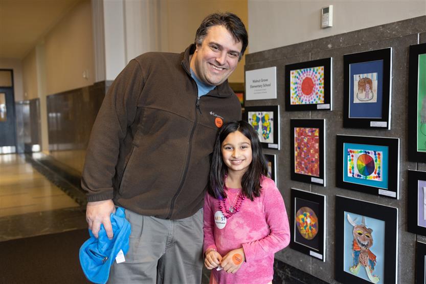 Students and their family at an art show